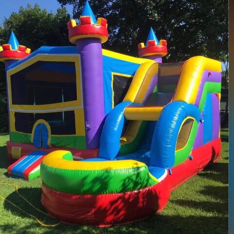 Colorful bounce house with an attached slide