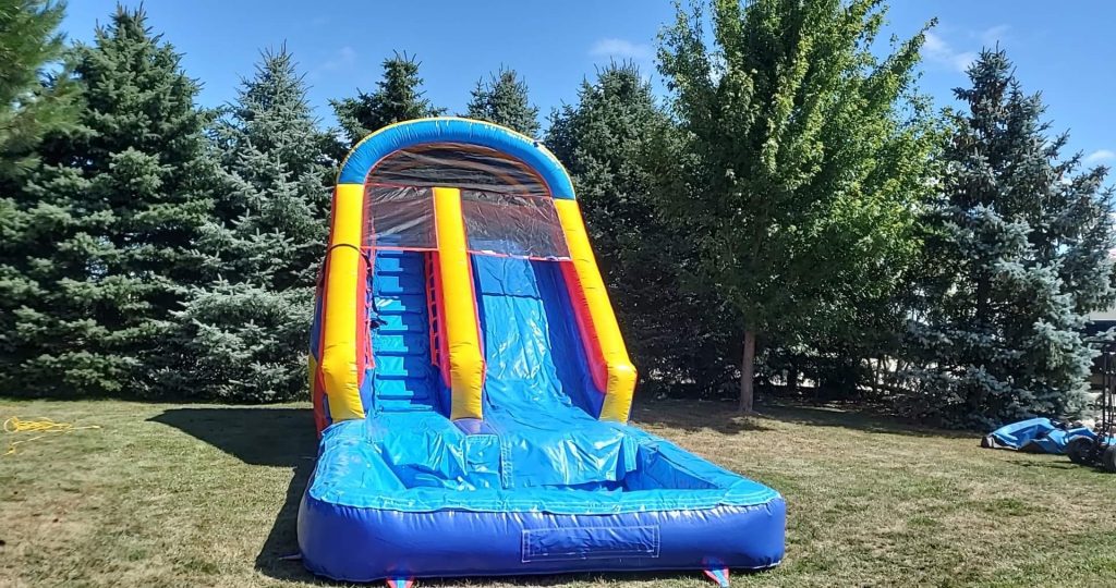 Colorful bounce house with an attached slide