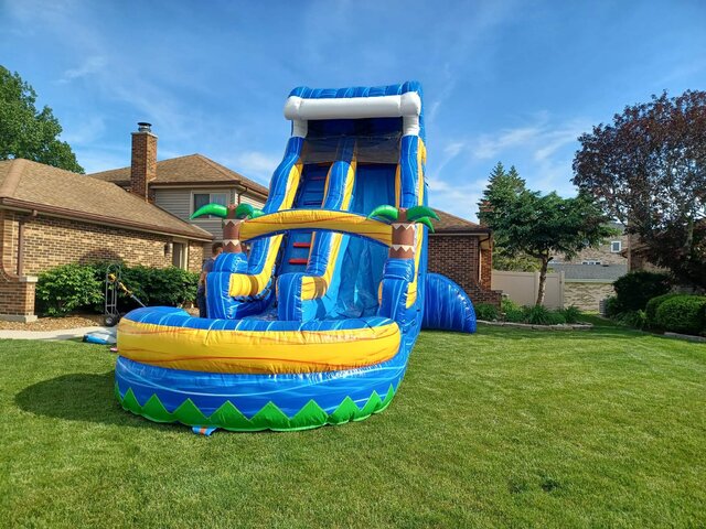 Colorful bounce house with an attached slide